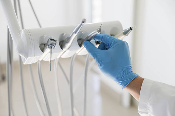 Professional Tooth Extraction technician working in Summerfield, NC